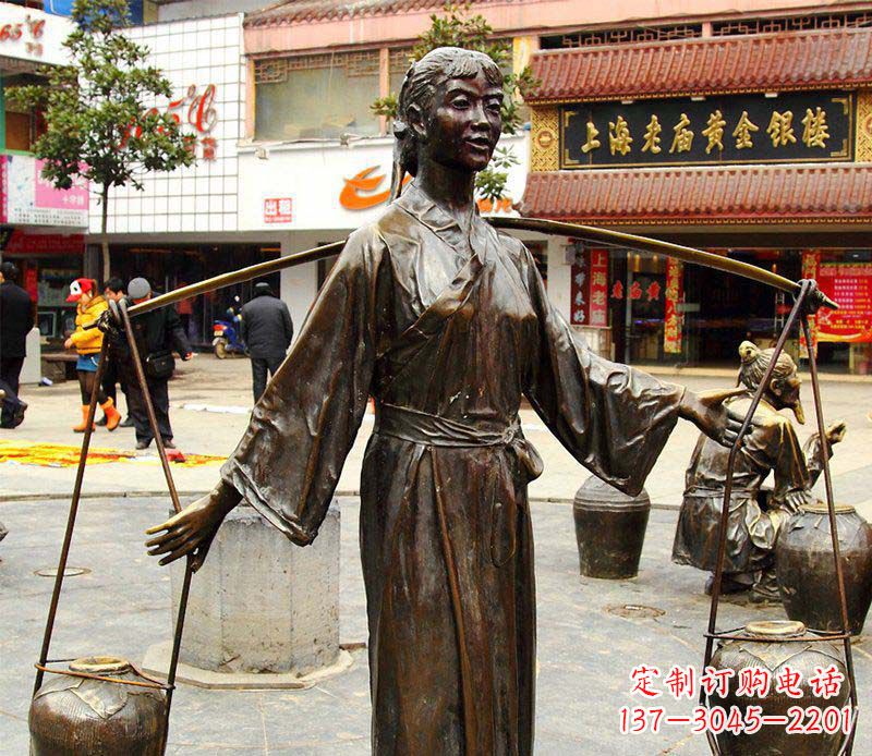 山西挑着罐子的古代女人铜雕