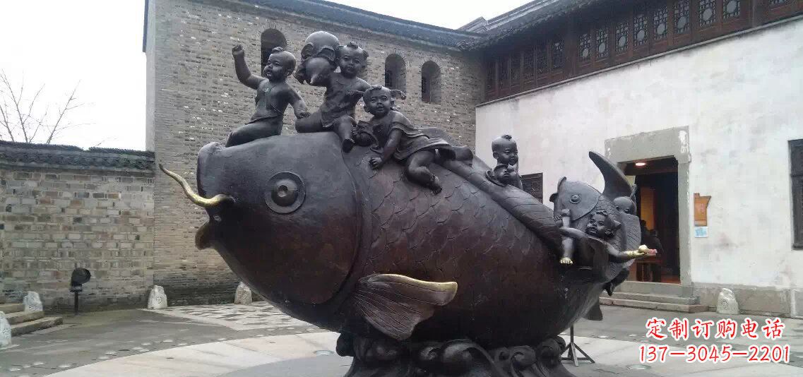 山西小孩骑鱼铜雕