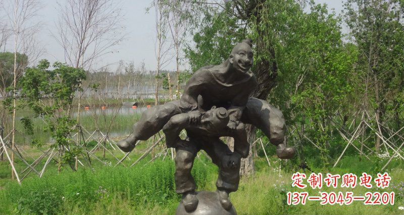山西园林站在球上面跳山羊的人物景观铜雕